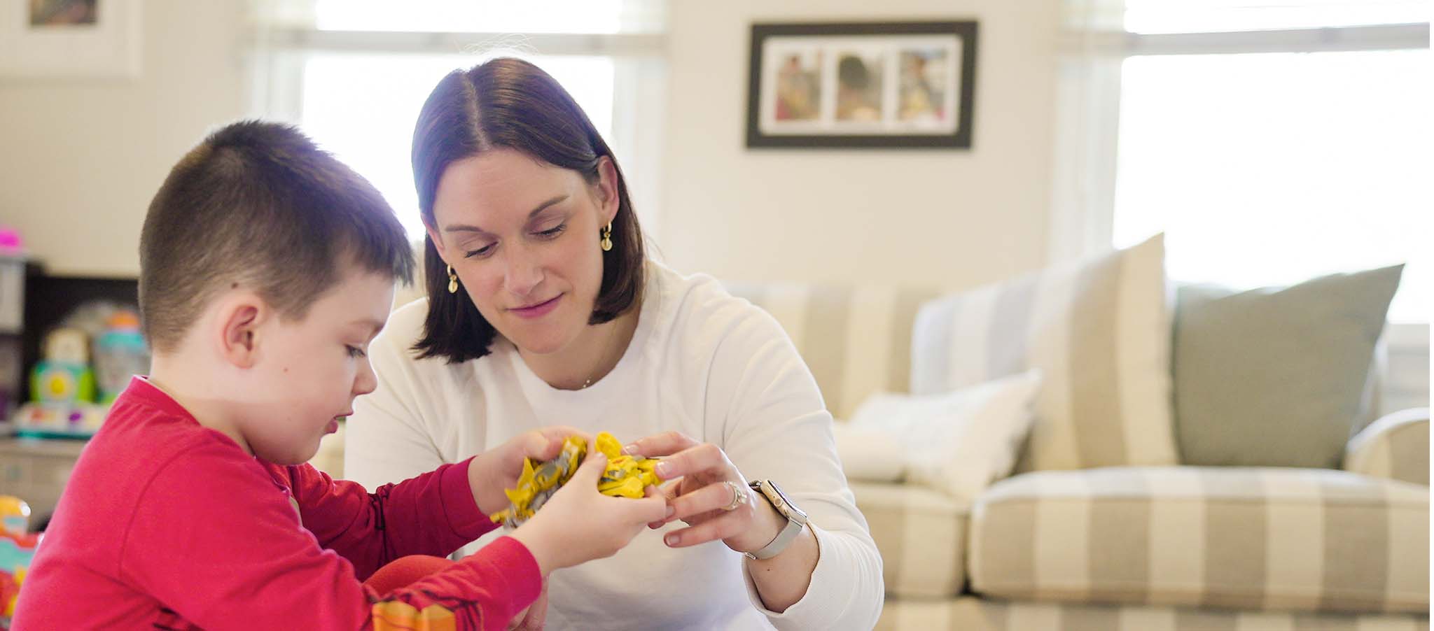 Caitlin playing with her son